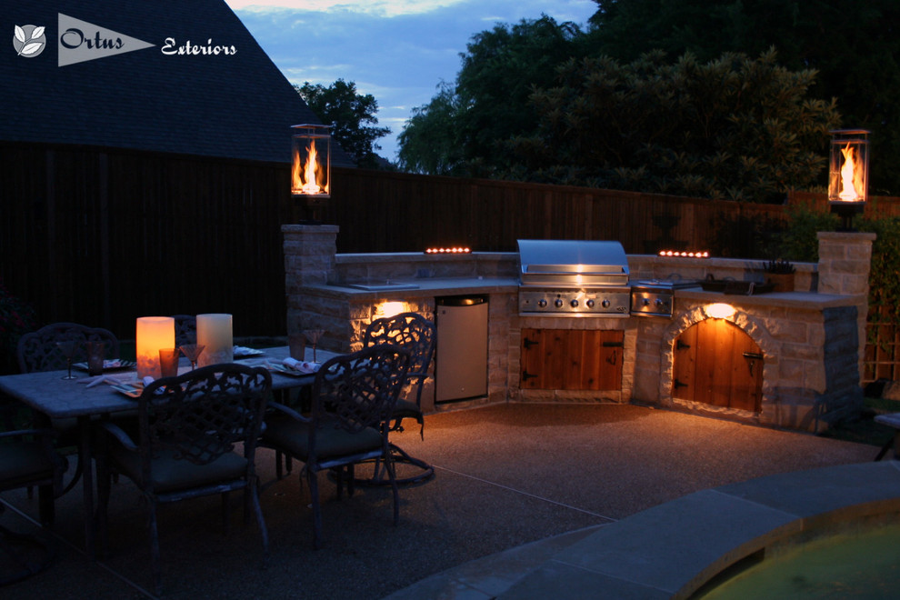 Inspiration for a medium sized classic back patio in Dallas with an outdoor kitchen, natural stone paving and no cover.