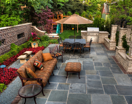 Patio - mid-sized backyard stone patio idea in Oklahoma City with no cover
