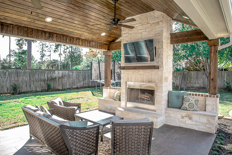 Large classic back patio in Houston with an outdoor kitchen, decking and a roof extension.