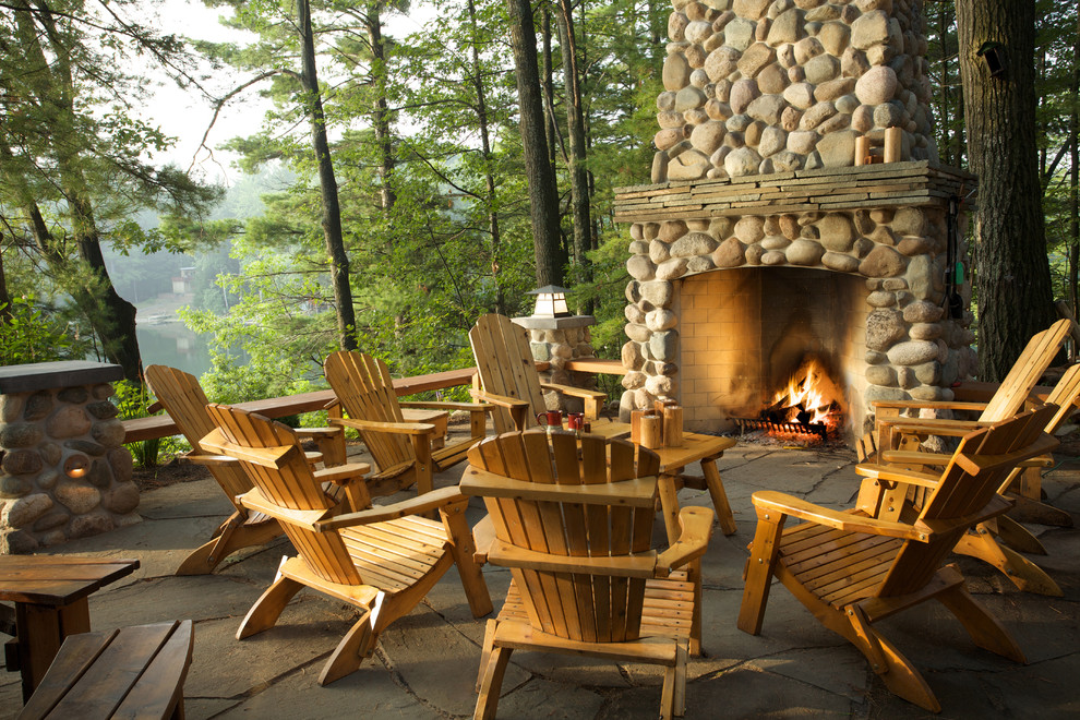 Inspiration for a rustic patio remodel in Other with a fire pit