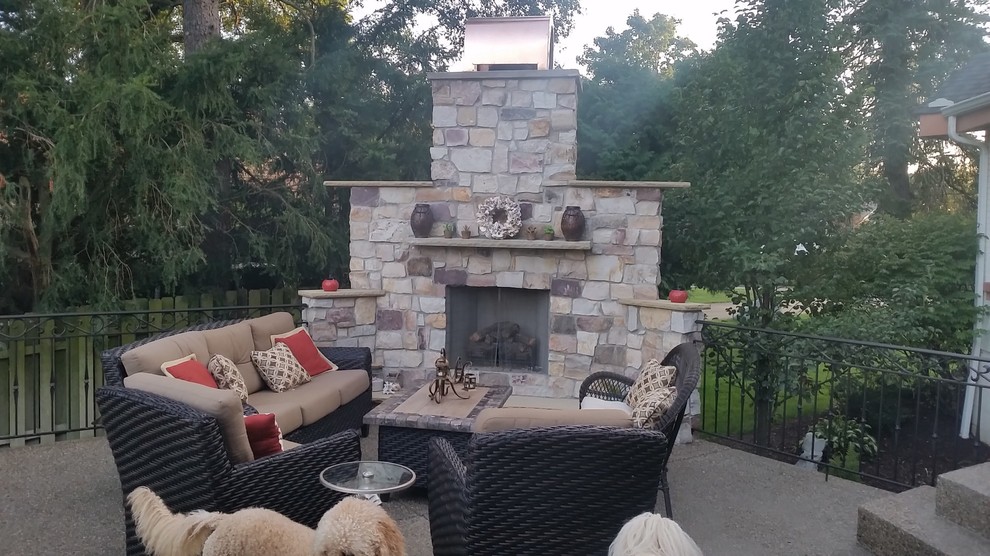 Design ideas for a medium sized classic back patio in Other with a fireplace, decomposed granite and no cover.