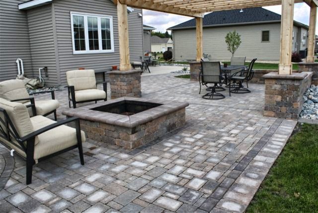 Inspiration for a medium sized traditional back patio in Minneapolis with an outdoor kitchen, brick paving and a pergola.