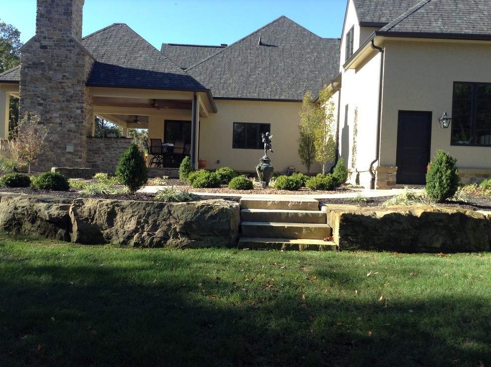 Inspiration for a large transitional backyard stone patio remodel in Indianapolis with a fire pit