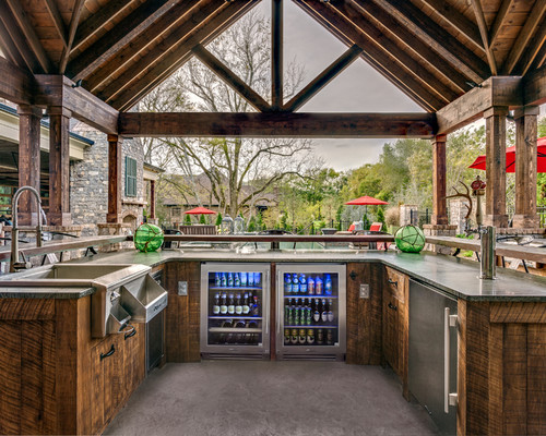 Outdoor Kitchens with Natural Wood Cabinets and Grey Concrete Flooring