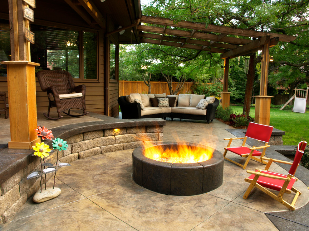 Inspiration for a contemporary patio in Seattle with a fire feature and a pergola.