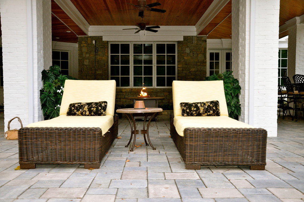 Patio - huge transitional backyard stone patio idea in Cincinnati with no cover and a fire pit
