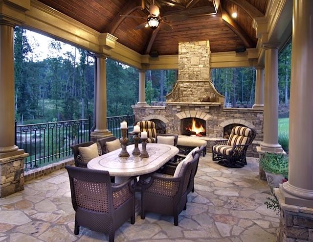 Large mountain style backyard patio photo in Atlanta with a fire pit, decking and a roof extension
