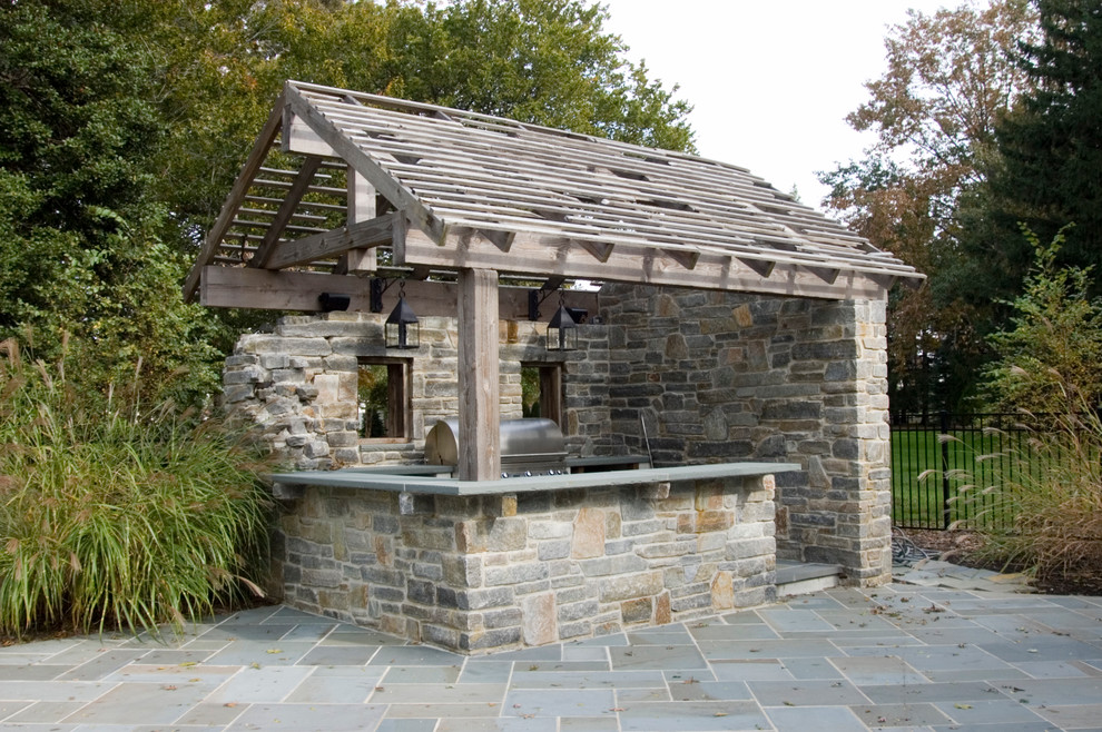 This is an example of a rustic patio in Philadelphia with a bbq area.