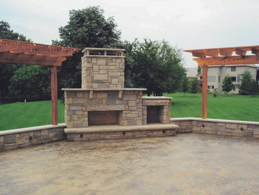 Medium sized modern back patio in Atlanta with a fireplace, concrete slabs and a pergola.