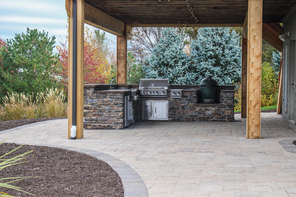 Outdoor Stone Kitchen Set with Grill, Sink, Oven, and Fridge Patio Omaha by Groundscapes
