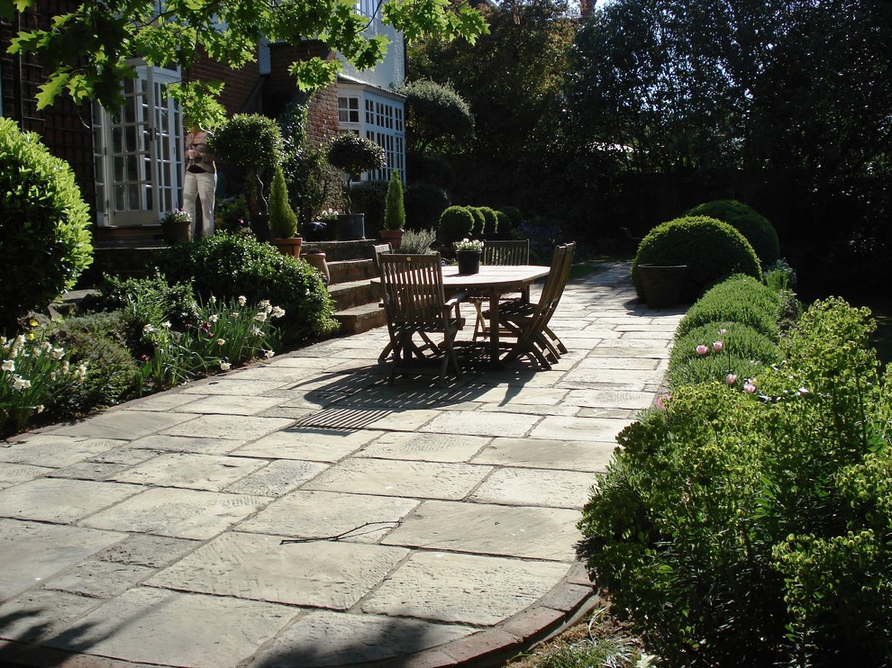 This is an example of a traditional patio in Surrey.