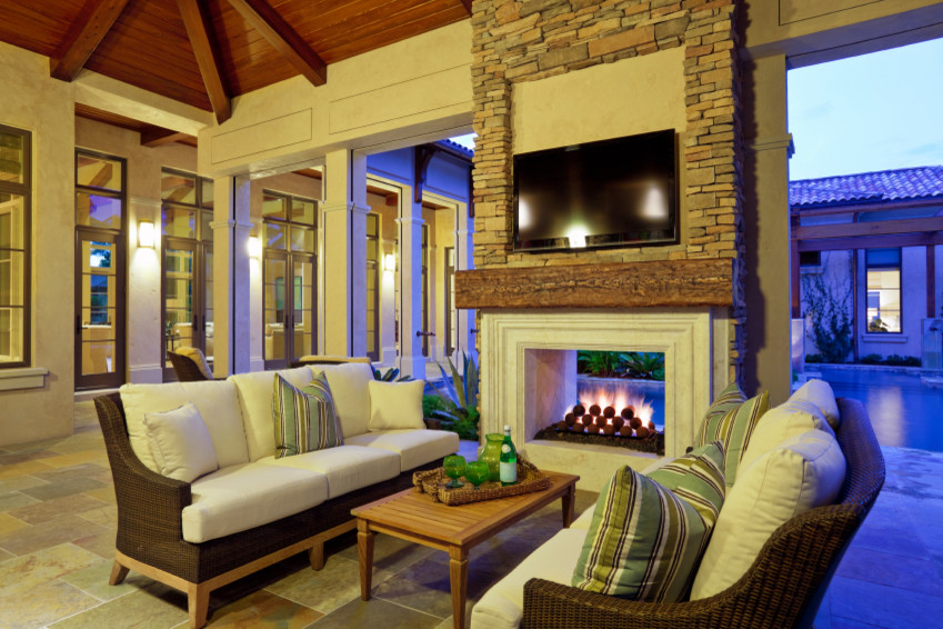 Inspiration for a mid-sized transitional backyard tile patio remodel in Atlanta with a fire pit and a roof extension