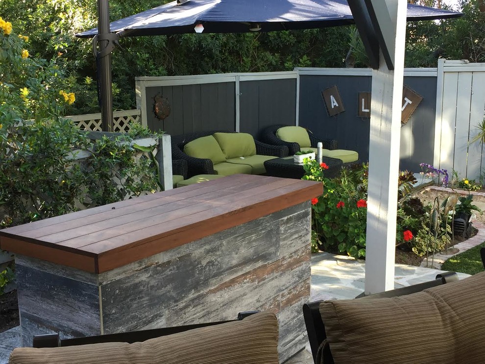 Mid-sized elegant backyard patio photo in San Francisco with decking and a gazebo
