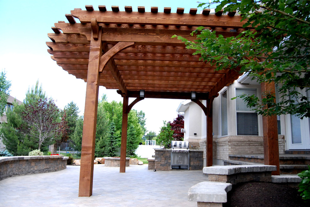 Traditional patio in Salt Lake City with a fire feature and a pergola.