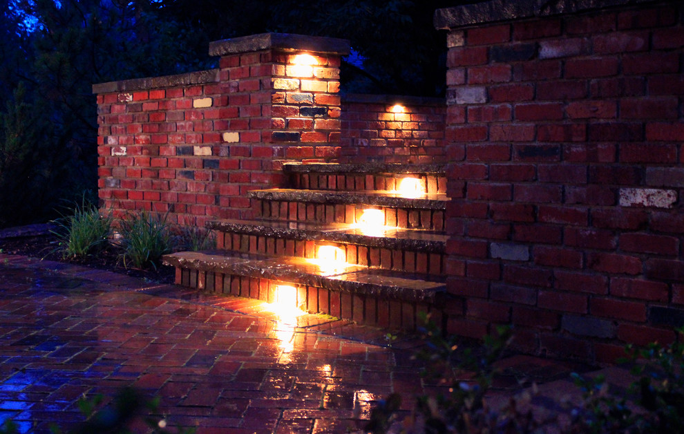 Patio - mid-sized traditional backyard brick patio idea in Denver