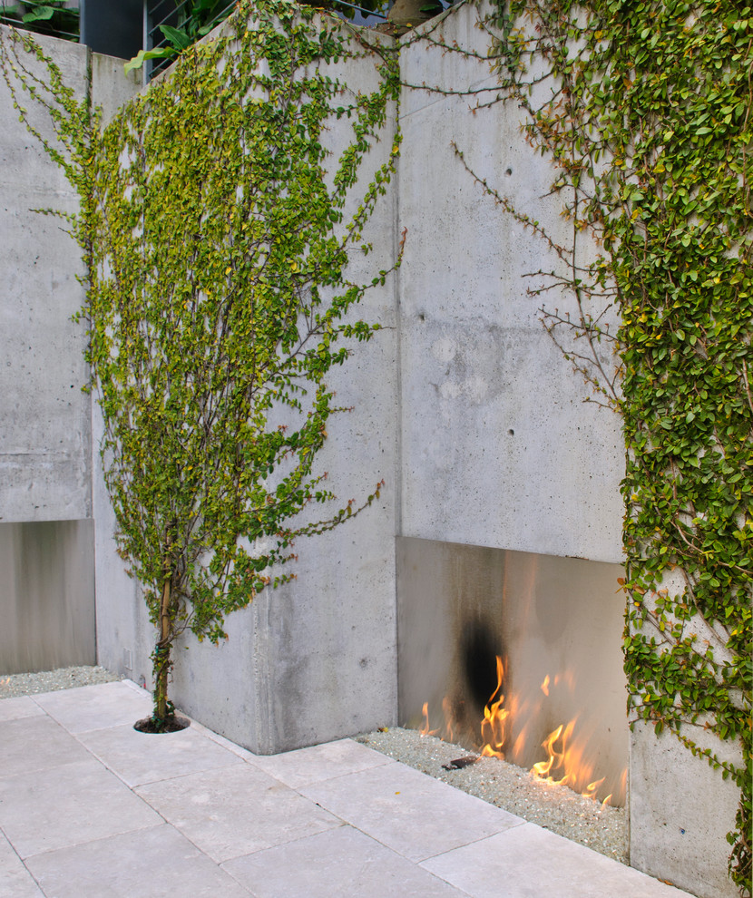 Patio - contemporary patio idea in San Francisco with a fireplace