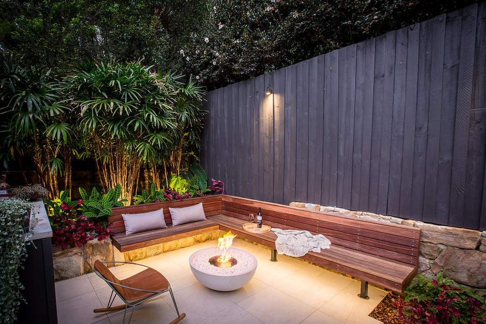 Patio - mid-sized contemporary courtyard patio idea in Sydney with a fire pit