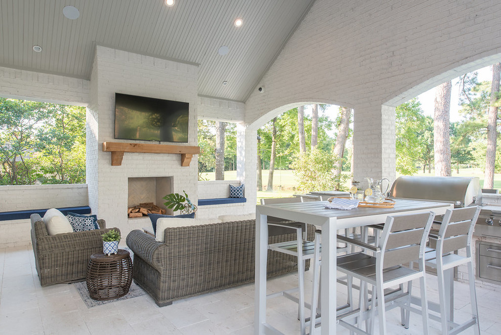 Large beach style back patio in Houston with tiled flooring, a roof extension and a bbq area.