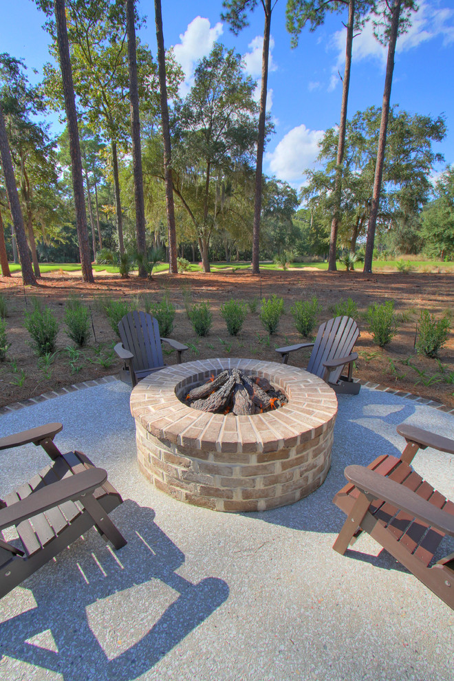 This is an example of a traditional patio in Atlanta with a fire feature.