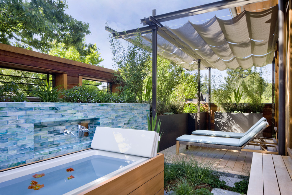 This is an example of a contemporary patio in San Francisco with decking and an outdoor shower.