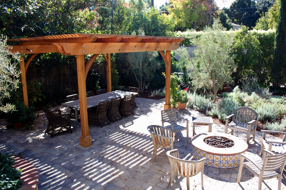 Inspiration for a large mediterranean courtyard tile patio remodel in San Francisco with a pergola