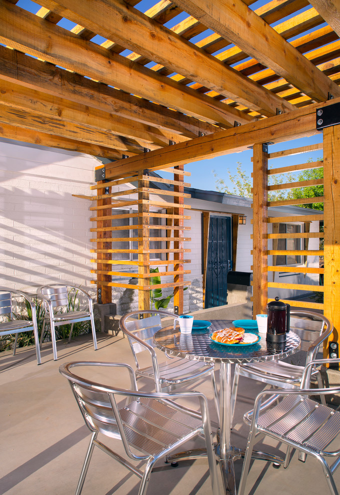 Patio - modern patio idea in Phoenix with a pergola