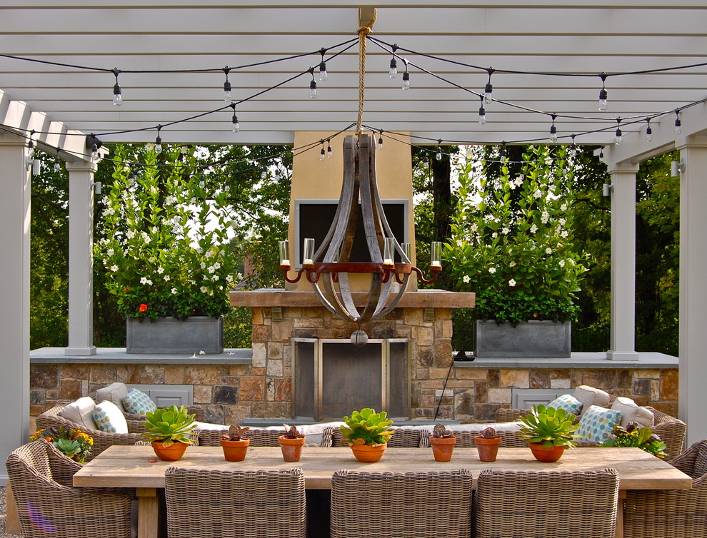 Example of a classic patio design in New York with a pergola