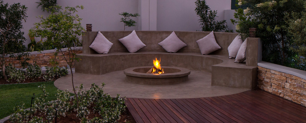 Design ideas for a contemporary patio in Other with a fire feature.