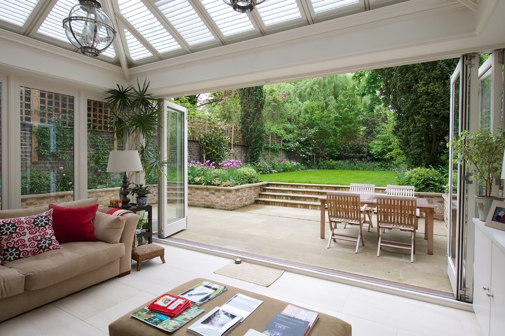 This is an example of a medium sized contemporary back patio in London with no cover.