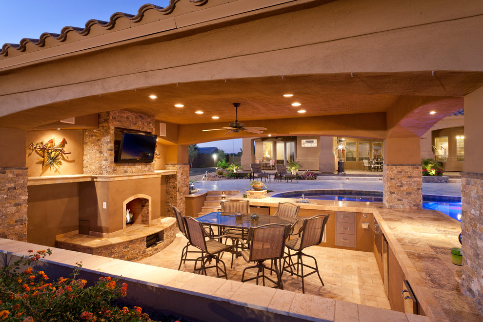 This is an example of a classic patio in Phoenix with a fire feature.