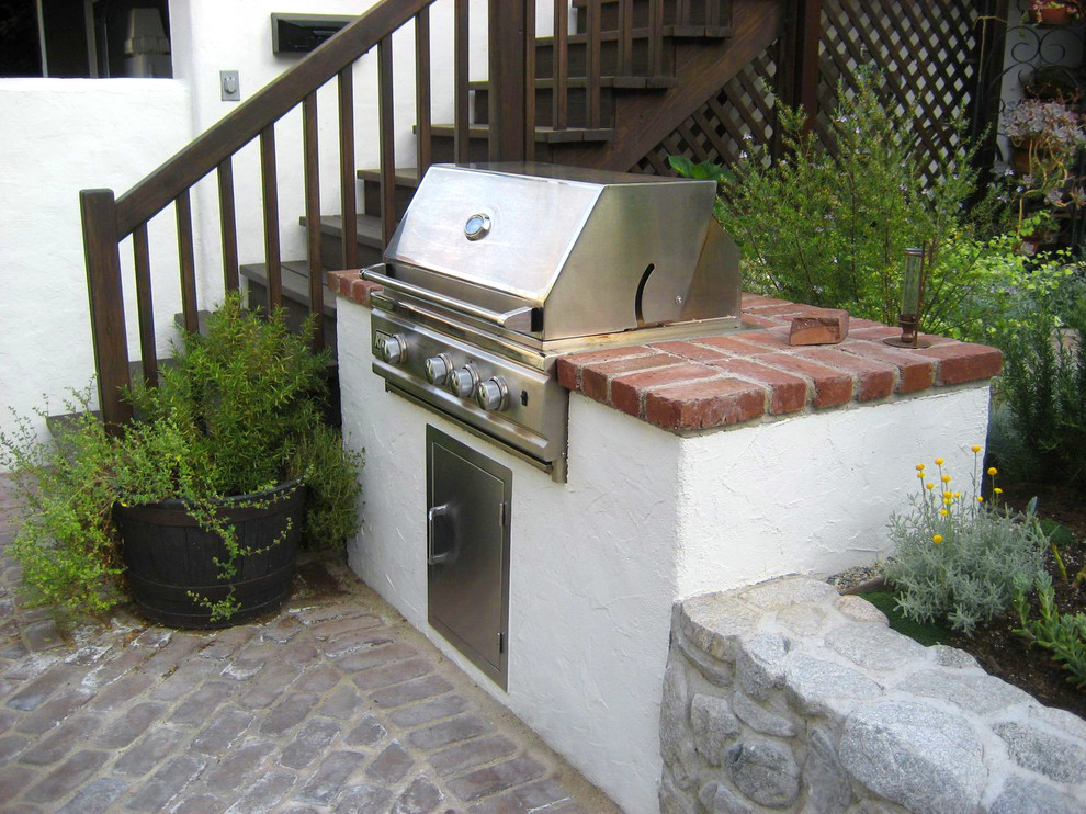 Small mountain style backyard brick patio kitchen photo in Los Angeles