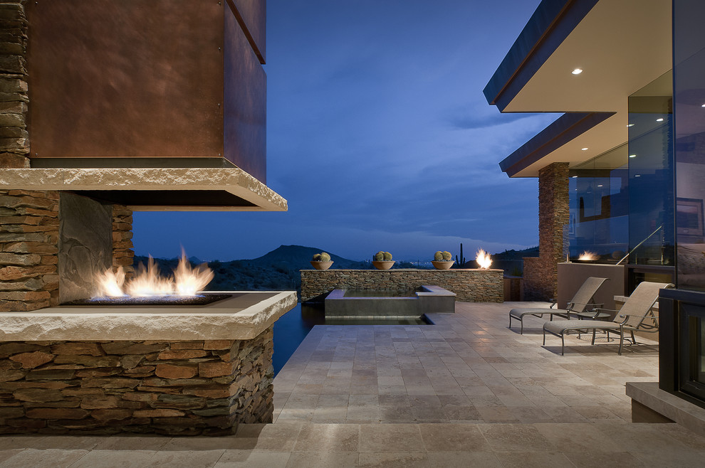 Patio - southwestern patio idea in Phoenix with a fire pit
