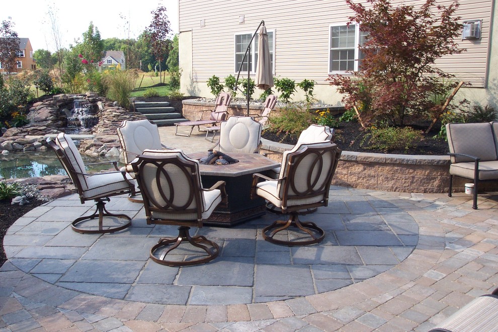 Patio - large traditional backyard concrete paver patio idea in Philadelphia with a gazebo and a fire pit