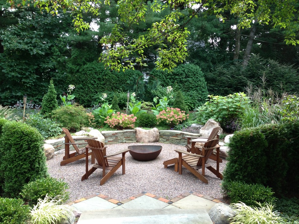 Elegant gravel patio photo in Burlington with a fire pit and no cover