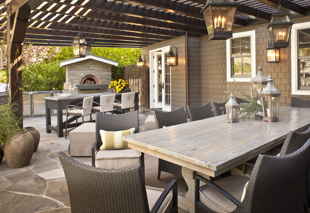 Inspiration for a timeless patio remodel in Los Angeles with a pergola