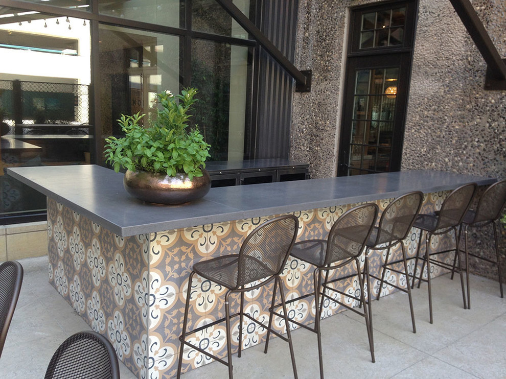 Minimalist stone patio kitchen photo in Minneapolis