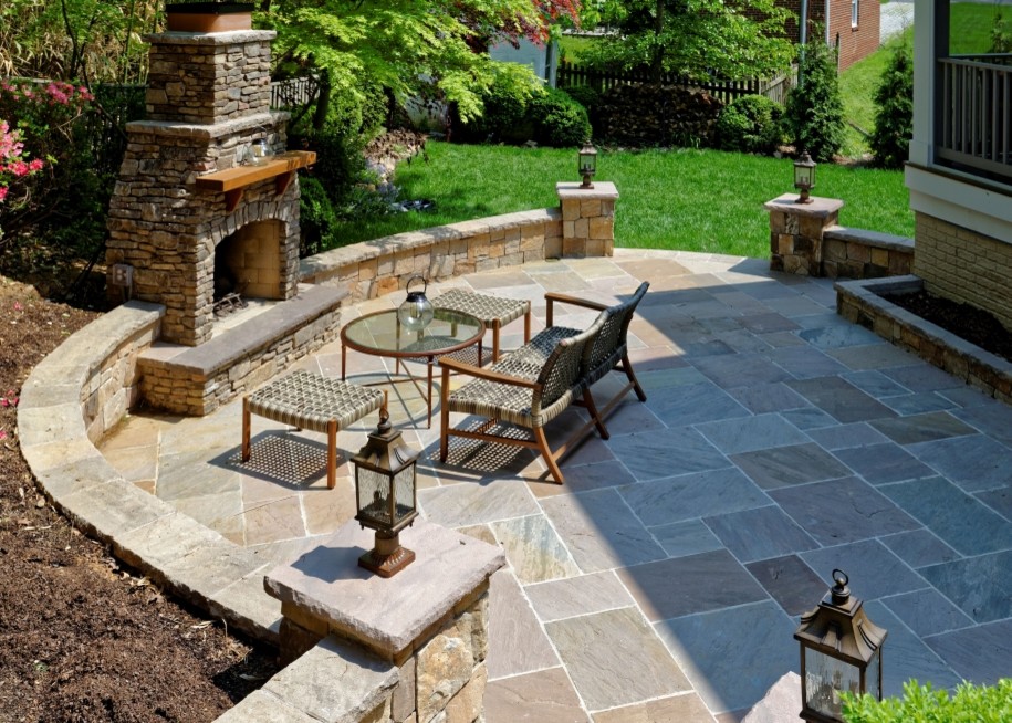 Large traditional back patio in DC Metro with a fire feature, concrete paving and no cover.