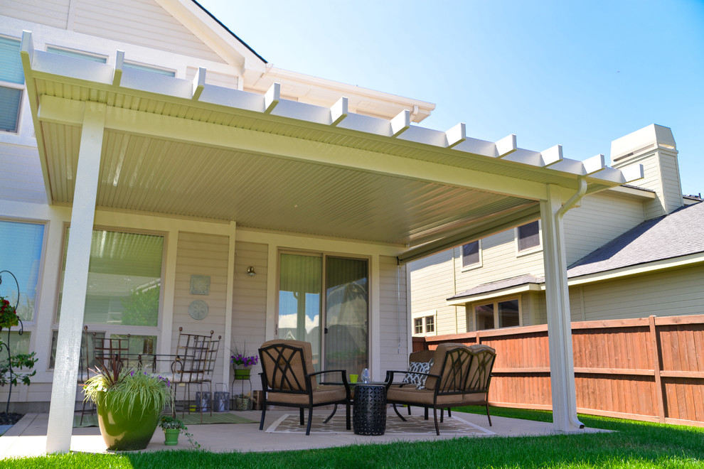 Inspiration for a timeless backyard patio remodel in Boise with an awning