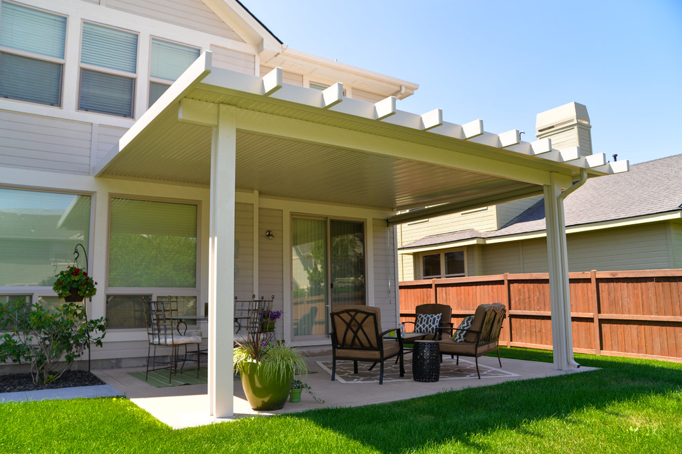 This is an example of a traditional back patio in Boise with an awning.