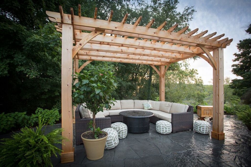 Design ideas for a medium sized contemporary back patio in Chicago with natural stone paving and a pergola.