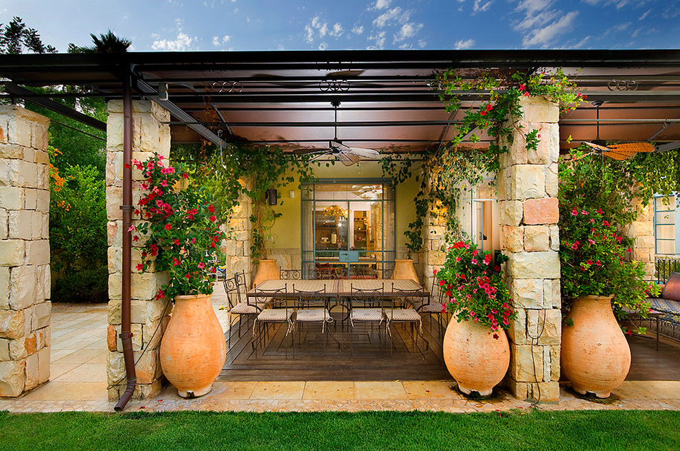Tuscan patio photo in Other with a gazebo
