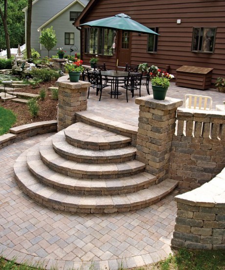 This is an example of a classic back patio in Other with concrete paving and no cover.
