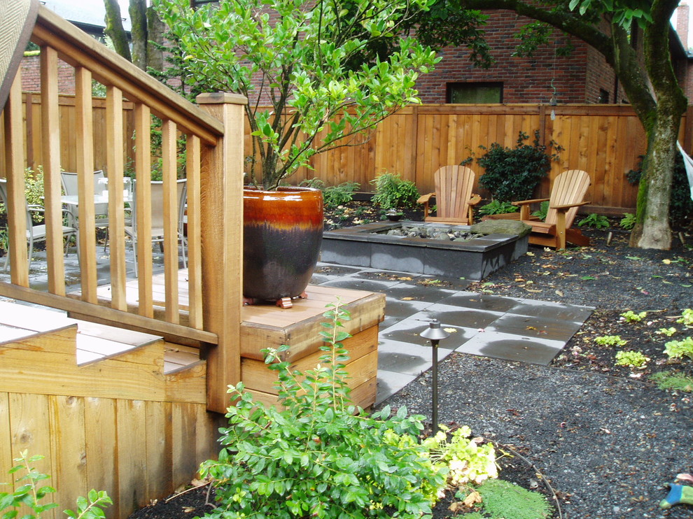 Patio - small transitional backyard concrete paver patio idea in Portland with a fire pit and no cover