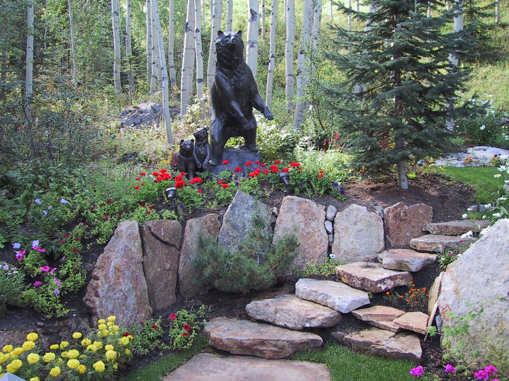 Medium sized country back patio in Denver with a living wall and natural stone paving.