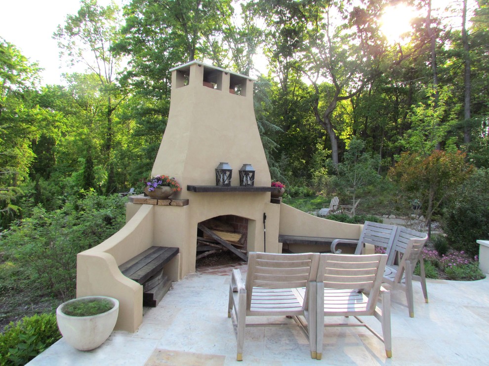 Example of a tuscan patio design in Newark with a fire pit and no cover