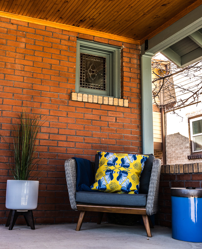 Diseño de patio de estilo americano pequeño en patio delantero y anexo de casas con losas de hormigón