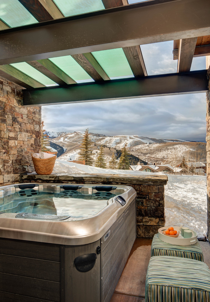 Mountain style patio photo in Salt Lake City with a pergola