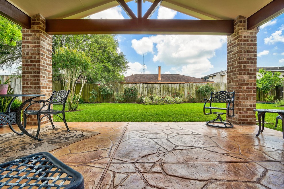 Mid-sized arts and crafts backyard tile patio photo in Houston with a roof extension