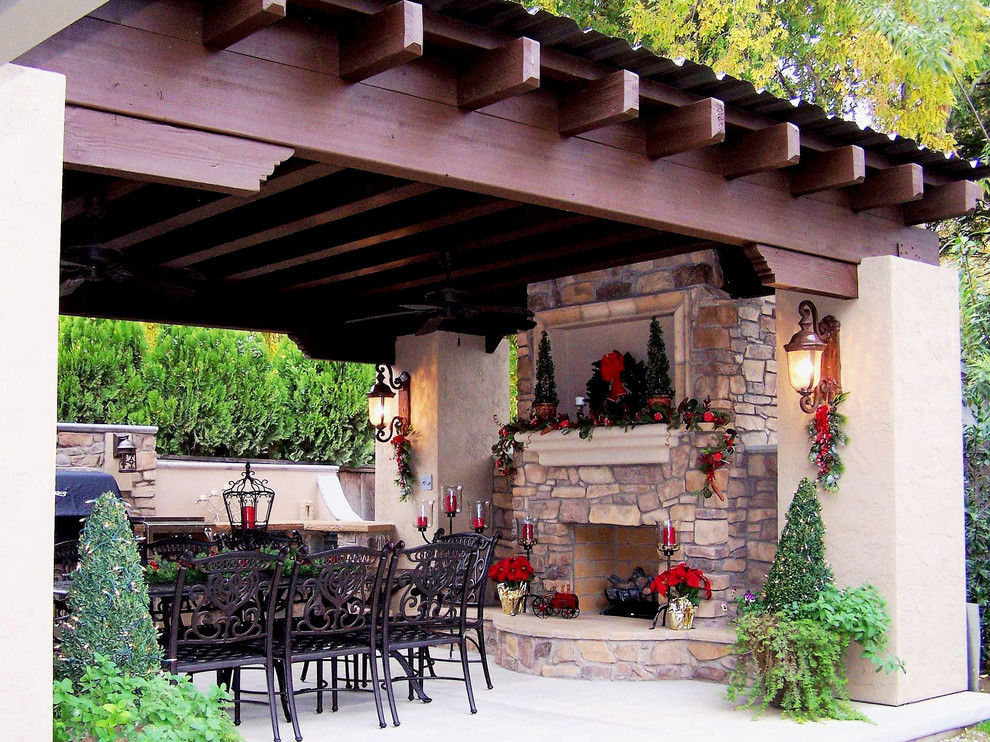 Patio - mid-sized craftsman backyard concrete patio idea in Other with a fire pit and a pergola