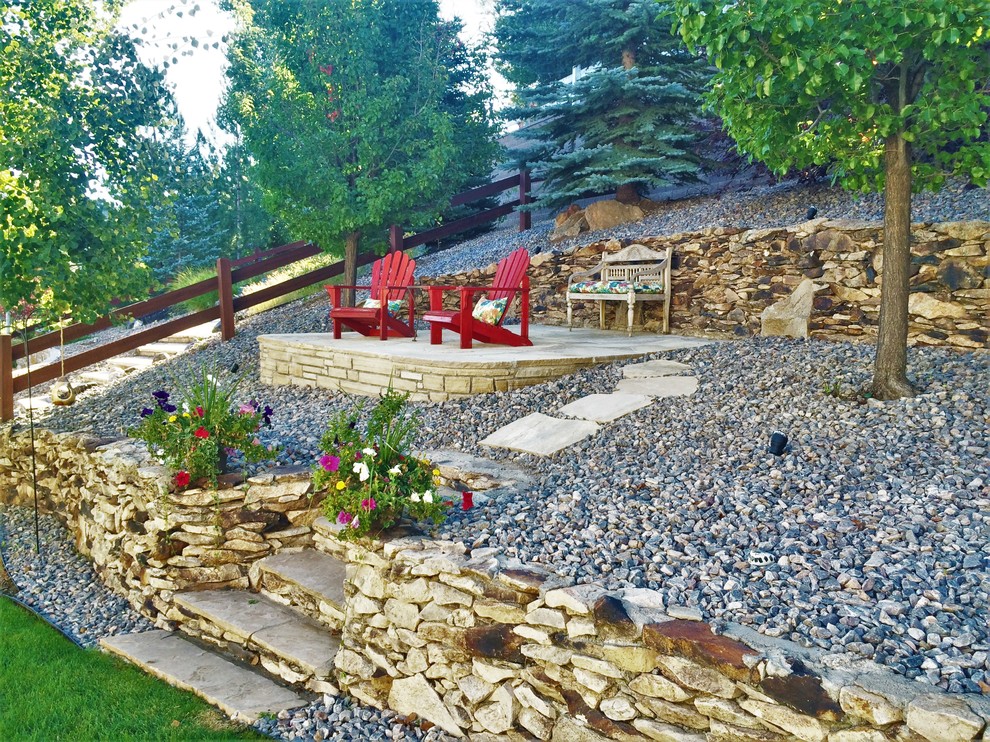 Large trendy backyard stone patio photo in Denver